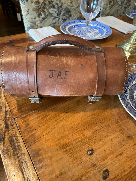 Two Lawn Bowls in a Leather Case